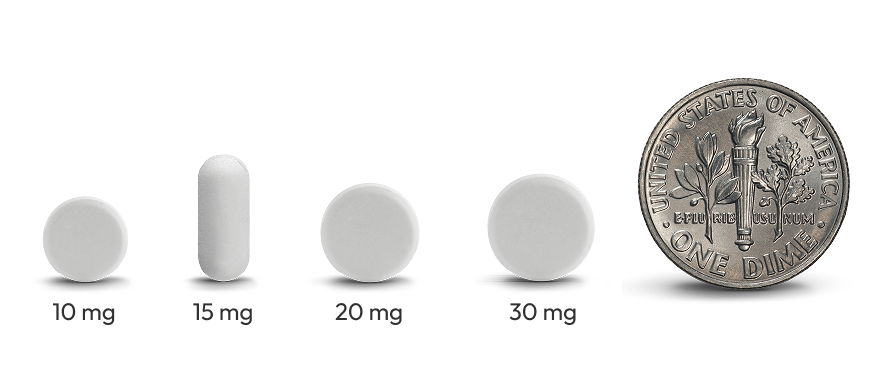4 LIVMARLI tablet sizes (10mg, 15mg, 20mg, and 30mg) with a dime for scale sitting to the right of them. All 4 tablets are smaller than the dime.